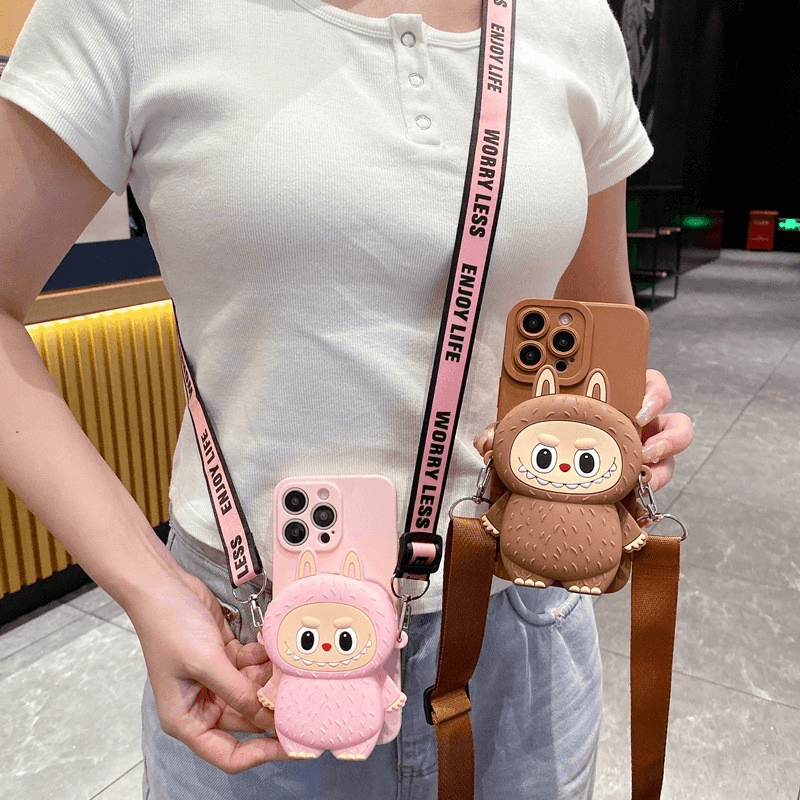 A collection of Labubu accessories like phone cases and watch bands on a desk