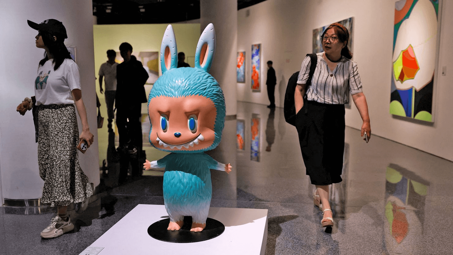 A rare life-sized Labubu figure displayed at an auction event