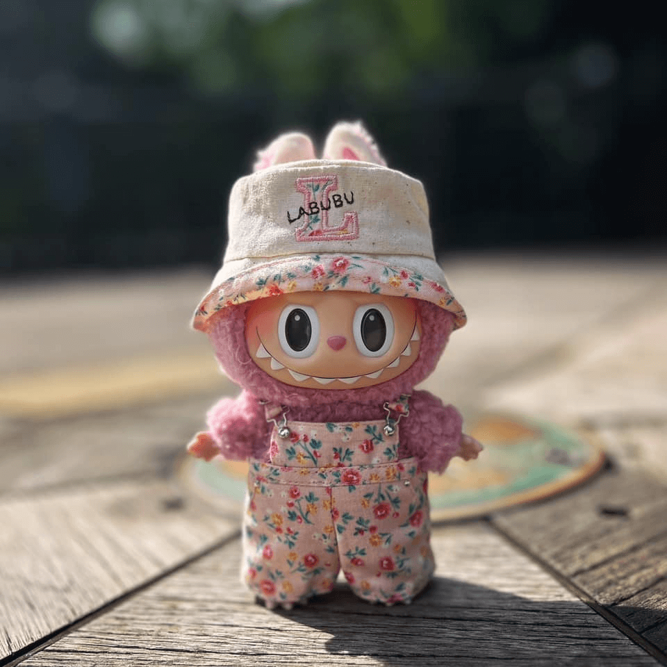 Side-by-side comparison of Labubu in various outfits, from dresses to overalls