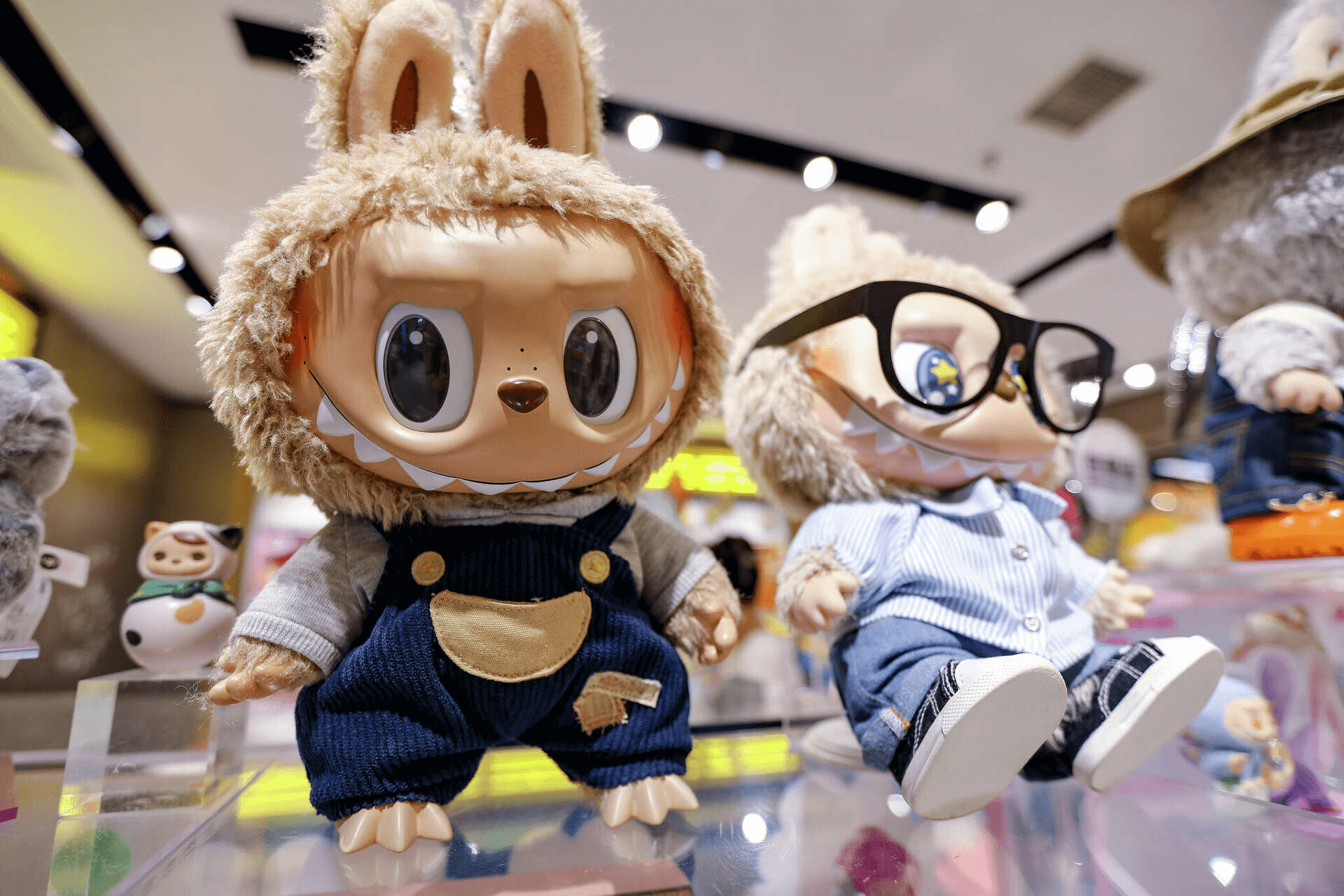 Labubu plush dolls lined up in a Pop Mart store, showcasing their signature grins