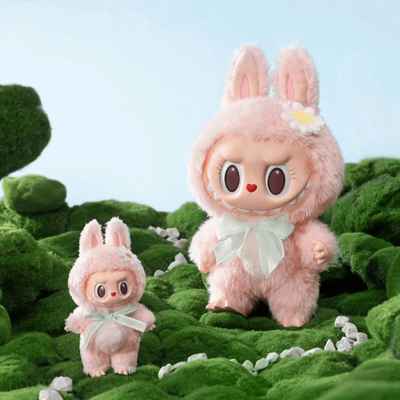 Mokoko figure with pastel pink fur, heart-shaped nose, and curly eyelashes