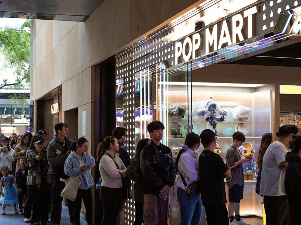A Pop Mart store with a crowd of eager collectors waiting for a Labubu release